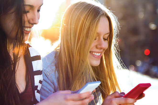 leap-lm-amp-the-future-of-media-f3 two-girls-laughing-at-their-phones